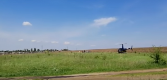 Поминание на сельское кладбище привези на вертолете / Фото: скриншот из видео Поминание на сельское кладбище привези на вертолете / Фото: скриншот из видео