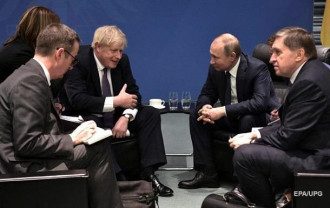 Джонсон и Путин в Берлине 19 января/Reuters Джонсон и Путин в Берлине 19 января/Reuters